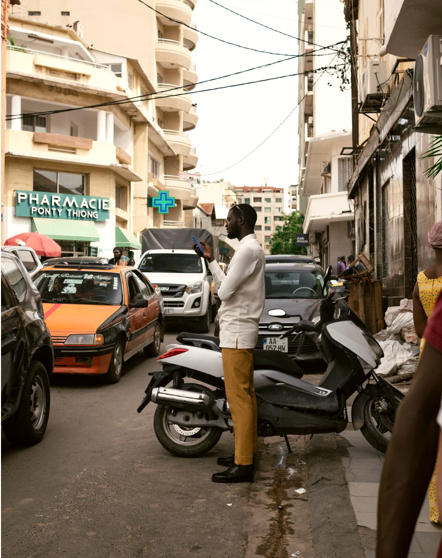 A pharmacy at street level in Dakar, where reliable supply meets the people who depend on it
